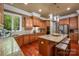 Bright kitchen showcasing updated appliances and a breakfast bar at 3301 Mcpherson St, Waxhaw, NC 28173