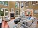 Bright living room with stone fireplace, tall ceilings, second story view, and lots of natural light at 3301 Mcpherson St, Waxhaw, NC 28173