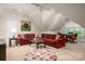 A loft living area features a sectional sofa, game table, and is naturally lit at 3301 Mcpherson St, Waxhaw, NC 28173
