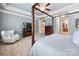 Bright primary bedroom with decorative tray ceiling and furniture at 3301 Mcpherson St, Waxhaw, NC 28173
