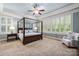 Serene primary bedroom with a canopy bed and abundant natural light at 3301 Mcpherson St, Waxhaw, NC 28173