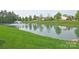 Scenic community pond with a water fountain feature, surrounded by green space perfect for recreation at 3301 Mcpherson St, Waxhaw, NC 28173