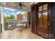 A covered porch features a seating area, ceiling fan, and a beautiful view of the neighborhood at 3301 Mcpherson St, Waxhaw, NC 28173