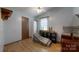 Bright bedroom with neutral walls, wood-look flooring, ceiling fan, and some furniture at 3379 Appletree Ct, Vale, NC 28168