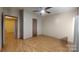 Large bedroom featuring wood-look flooring, a ceiling fan, and a wide open space at 3379 Appletree Ct, Vale, NC 28168
