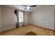 Bedroom featuring hardwood floors, a ceiling fan, and a bright window with curtains at 3379 Appletree Ct, Vale, NC 28168