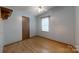 Empty bedroom featuring wood-look flooring, a ceiling fan, and neutral paint at 3379 Appletree Ct, Vale, NC 28168