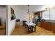Kitchen with a dining table, appliances, wood cabinets, and a chandelier at 3379 Appletree Ct, Vale, NC 28168