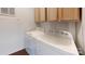Laundry room featuring a washer and dryer with wooden cabinets above at 3379 Appletree Ct, Vale, NC 28168