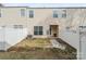Private backyard featuring a fenced-in area, a small patio, and a well-maintained lawn at 3623 Danvers St, Charlotte, NC 28213