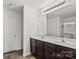 This bright bathroom features a double sink vanity with a large mirror and modern lighting at 3623 Danvers St, Charlotte, NC 28213