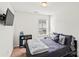 A bright bedroom includes a large window, closet, and neutral color palette at 3623 Danvers St, Charlotte, NC 28213