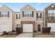 Charming townhome featuring a two-car garage and a welcoming front porch at 3623 Danvers St, Charlotte, NC 28213