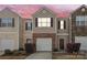 Charming townhome with neutral siding, a brick accent, and a one-car garage on a colorful sky background at 3623 Danvers St, Charlotte, NC 28213