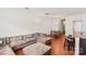 Comfortable living room featuring a plush sectional sofa, hardwood floors, and ample natural light at 3623 Danvers St, Charlotte, NC 28213