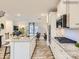 Modern kitchen with white cabinets, a spacious island and sleek stainless steel appliances at 4132 Skyboat Cir, Fort Mill, SC 29715