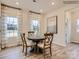 Charming dining area with hardwood style floors and two sunny windows at 4140 Skyboat Cir, Fort Mill, SC 29715