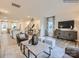 Bright living room with modern decor that opens to the kitchen and staircase at 4140 Skyboat Cir, Fort Mill, SC 29715
