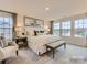 Relaxing main bedroom bathed in natural light, with a bench and neutral decor at 4140 Skyboat Cir, Fort Mill, SC 29715