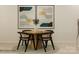 Cozy dining area with a round wooden table, stylish chairs, and modern artwork enhancing the space at 4539 Potters Wheel Dr, Fort Mill, SC 29715