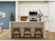 Bright kitchen with white cabinets, modern appliances, and a breakfast bar with seating at 4543 Potters Wheel Dr, Fort Mill, SC 29715