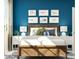 Well-lit bedroom featuring a wood framed bed, framed art, and matching nightstands at 4567 Potters Wheel Dr, Fort Mill, SC 29715