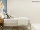 Well-lit bedroom with wood nightstand, stylish decor, and a comfortable bed at 4567 Potters Wheel Dr, Fort Mill, SC 29715
