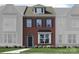 Charming brick two-story townhome with well-maintained landscaping at 4567 Potters Wheel Dr, Fort Mill, SC 29715