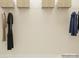 A closet is displayed with metal shelving and hanging clothes to showcase a place for storage at 4567 Potters Wheel Dr, Fort Mill, SC 29715