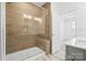 Modern bathroom featuring a glass shower with light brown tile surround and marble floors at 5005 Sovereignty Ct, Charlotte, NC 28205