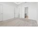 Spacious bedroom with carpet, ensuite bathroom, and neutral color scheme at 5005 Sovereignty Ct, Charlotte, NC 28205