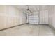 Spacious, unfinished garage interior with a white door and ample room for vehicles and storage at 5005 Sovereignty Ct, Charlotte, NC 28205