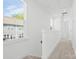 Hallway with carpet, large windows, and plenty of natural light at 5005 Sovereignty Ct, Charlotte, NC 28205