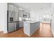Open kitchen featuring a large island, stainless steel appliances, and ample counter space at 5005 Sovereignty Ct, Charlotte, NC 28205