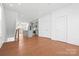 Bright, open-concept living space with hardwood floors flows into a modern kitchen at 5005 Sovereignty Ct, Charlotte, NC 28205