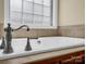 Close up of a new, clean bathtub with stylish faucet and great natural lighting at 575 Hill Rd, Lincolnton, NC 28092