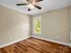 Bedroom with wood floor, one window and a ceiling fan at 575 Hill Rd, Lincolnton, NC 28092