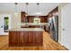 Well-appointed kitchen with granite countertops, stainless steel appliances, and a central island at 575 Hill Rd, Lincolnton, NC 28092