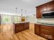 Open concept kitchen with island, granite countertops, and stainless steel microwave at 575 Hill Rd, Lincolnton, NC 28092