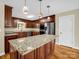 Modern kitchen featuring granite countertops, stainless steel appliances, and ample cabinet space at 575 Hill Rd, Lincolnton, NC 28092