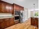 Kitchen with stainless steel fridge and appliances, granite counters, and wooden cabinets at 575 Hill Rd, Lincolnton, NC 28092