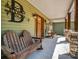 Charming front porch with wooden benches and view of the front yard at 575 Hill Rd, Lincolnton, NC 28092