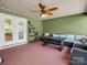 Covered porch with outdoor seating and ceiling fan is perfect for relaxing and enjoying the outdoors at 575 Hill Rd, Lincolnton, NC 28092