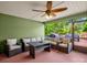Enclosed porch featuring an outdoor sofa and ceiling fan at 575 Hill Rd, Lincolnton, NC 28092
