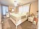 Comfortable main bedroom with a ceiling fan, carpet, and a well-placed dresser and nightstands at 606 E Carpenter St, Dallas, NC 28034