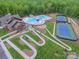 Aerial view of clubhouse with pool, tennis court, walking paths and landscaping at 609 Kahana River Rd, Fort Mill, SC 29715