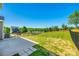 Spacious backyard features a concrete patio area and a well-maintained lawn, ideal for outdoor entertaining at 609 Kahana River Rd, Fort Mill, SC 29715