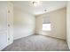 Bedroom with plush carpet, natural light from the window and ceiling light at 609 Kahana River Rd, Fort Mill, SC 29715
