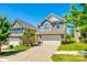 Charming two-story home featuring a two-car garage and manicured landscaping for a welcoming curb appeal at 609 Kahana River Rd, Fort Mill, SC 29715