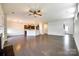 Spacious living room with hardwood floors and seamless transitions to the kitchen, perfect for modern living and entertaining at 609 Kahana River Rd, Fort Mill, SC 29715